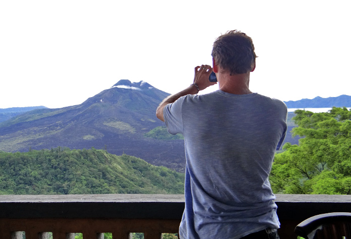 Rob taking a photo of a volcano in Bali