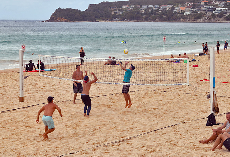 playing beach volleyball at Manly Beach, Sydney Australia